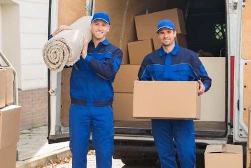Packed moving boxes and furniture for a Putney removal service