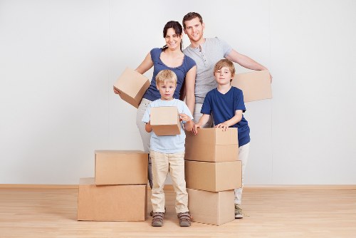 Careful unloading of household items at a Putney property