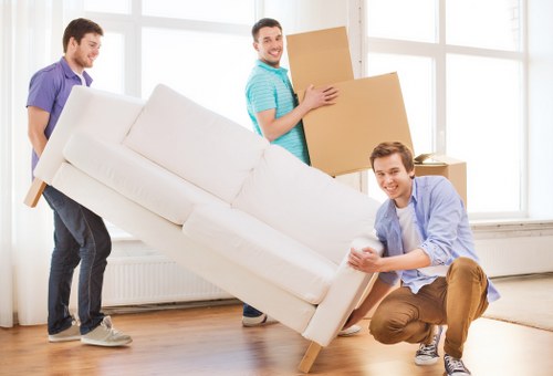 Staff using safe lifting practices during a property move