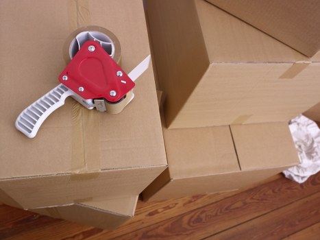 Removal team loading furniture for a Putney home move
