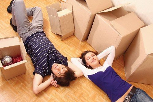 Moving team maintaining health and safety standards during a job