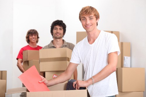 Unpacking boxes in a Putney apartment after relocation